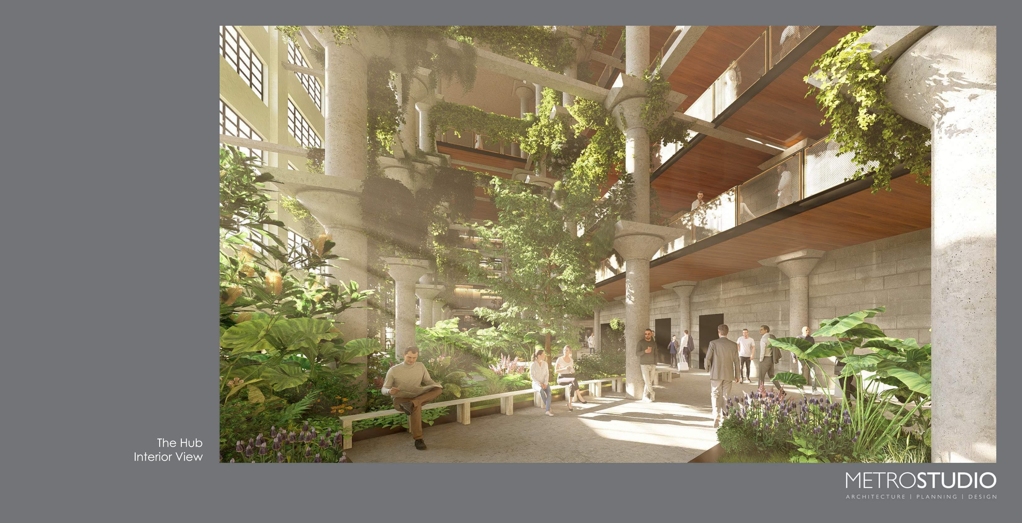The Hub interior — lush atrium with greenery and shared workspaces